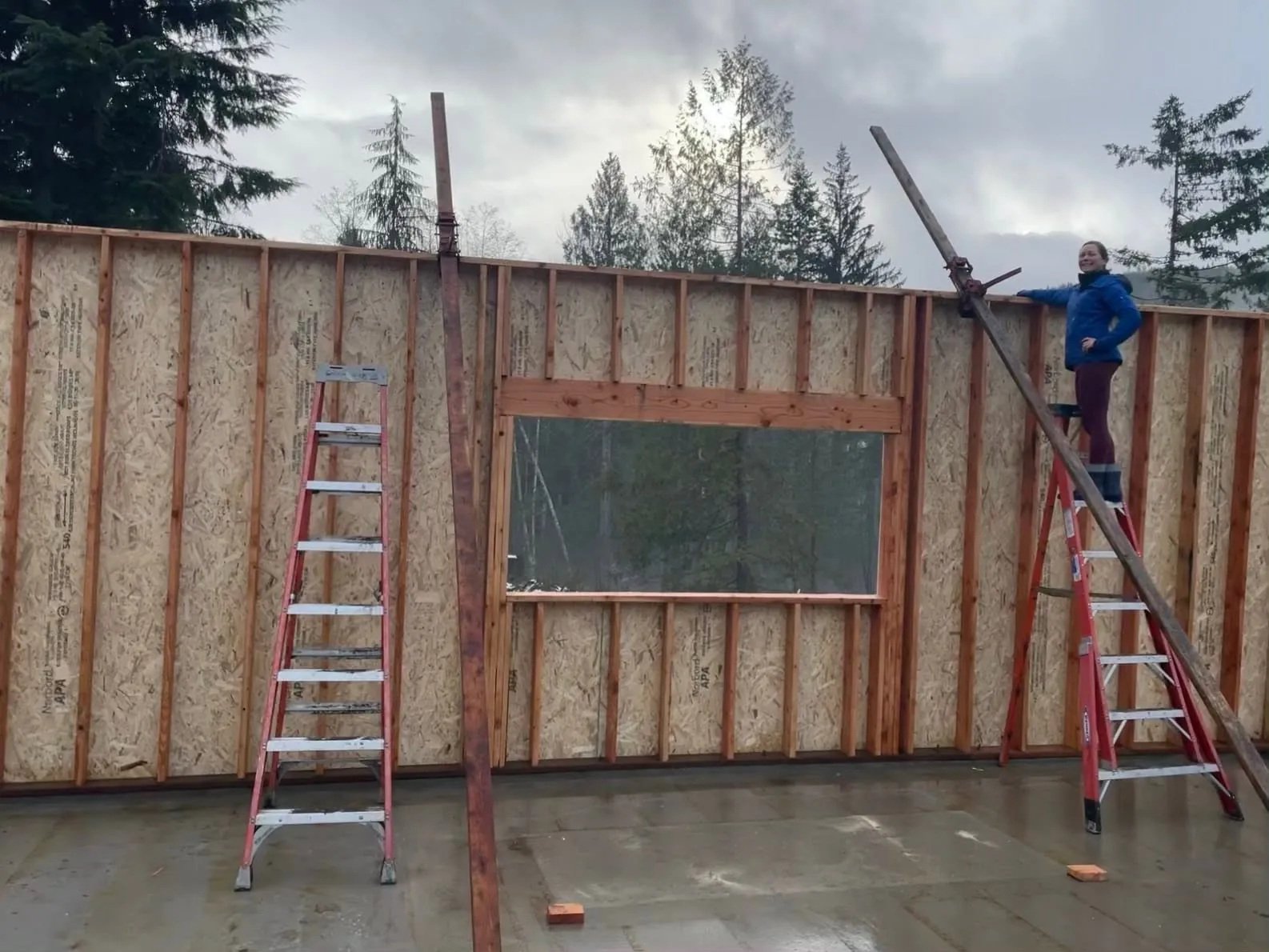 CKS Builders LLC crew raising a framed exterior wall on a home project in Port Angeles, WA