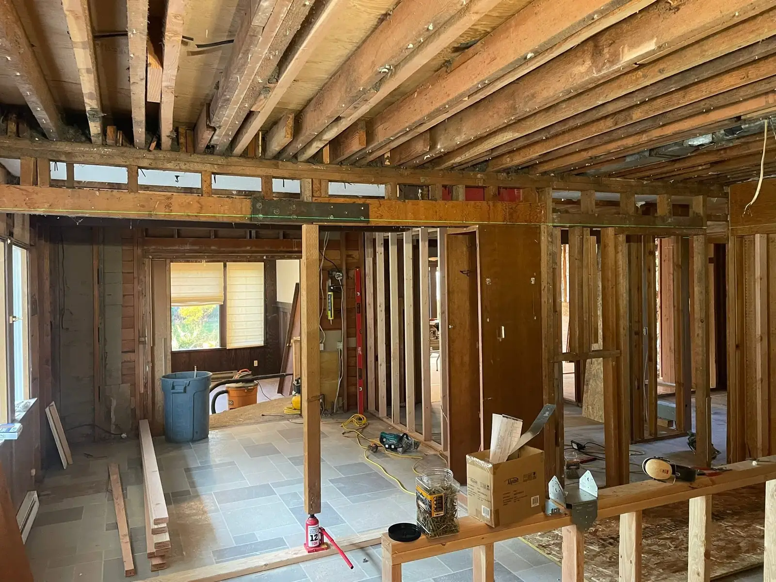 Interior of an older home stripped back to the studs and joists during a remodel by CKS Builders LLC in Port Angeles, WA