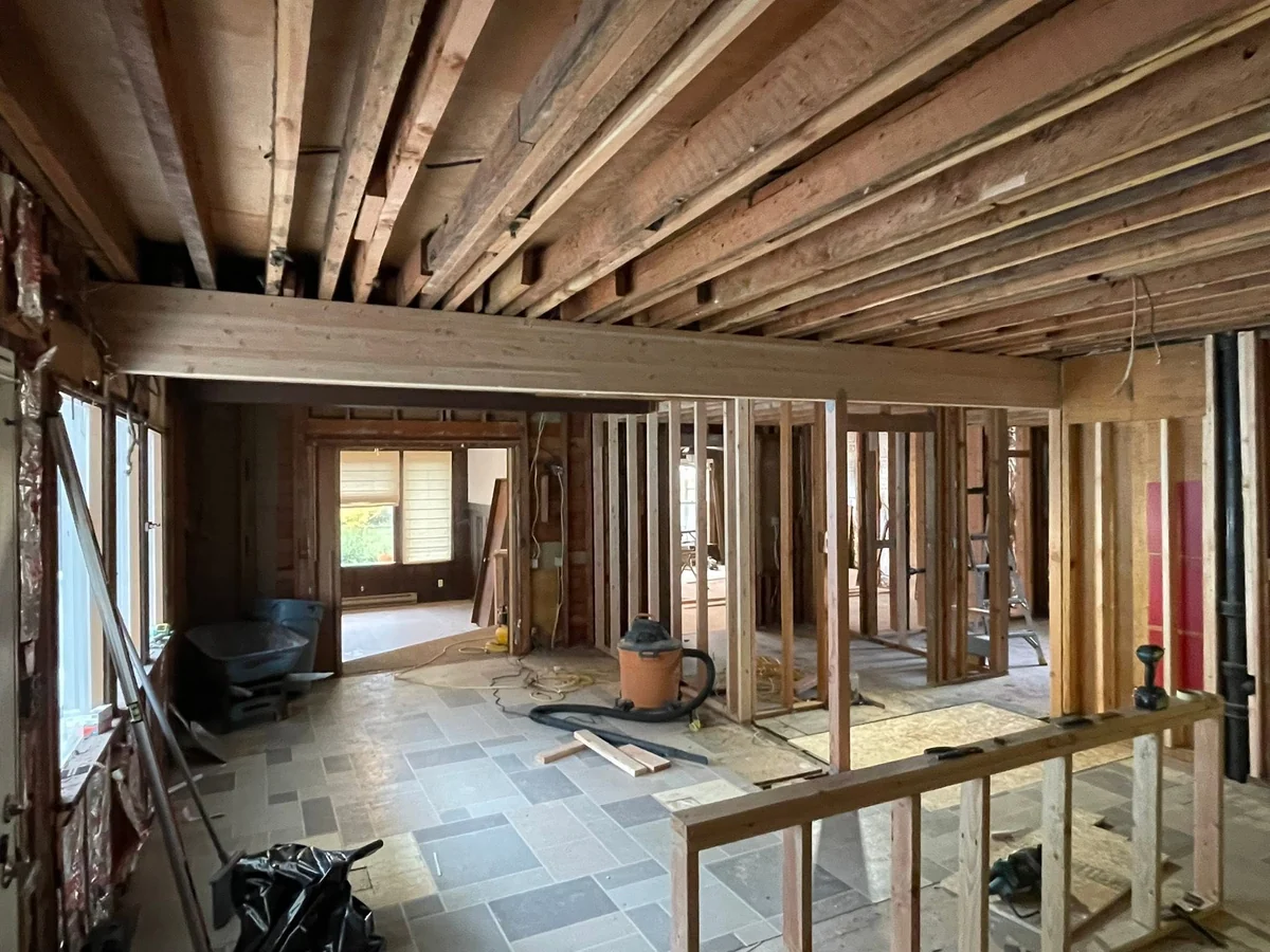 Upper level stripped back to the framing and floor joists during a whole-home remodel by CKS Builders LLC in Port Angeles, WA