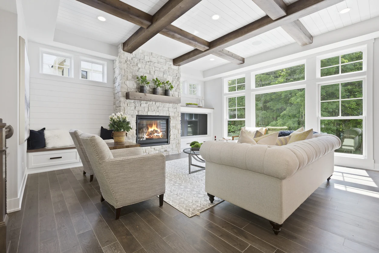 Older home interior reworked into an open living space with a stone fireplace