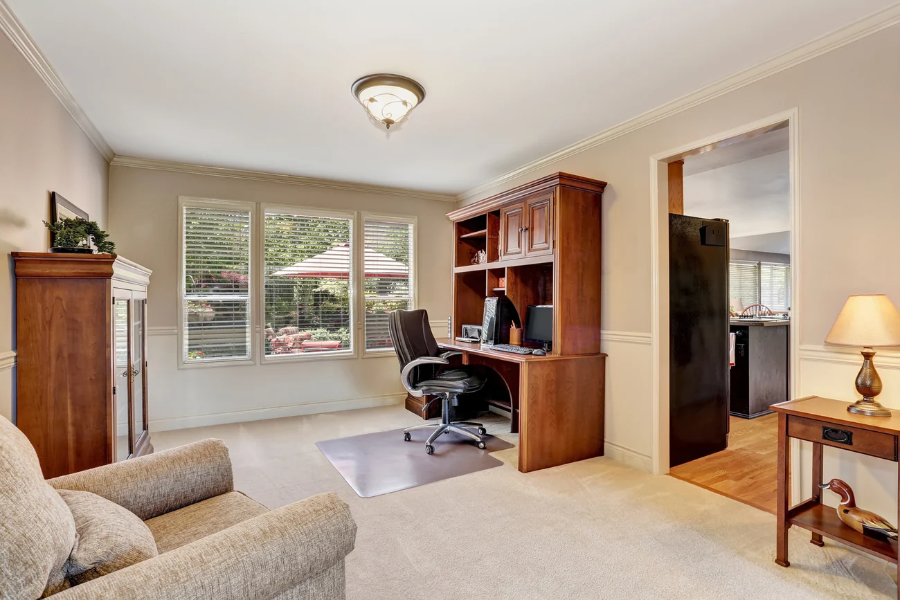 Home office addition with a built-in desk and shelving