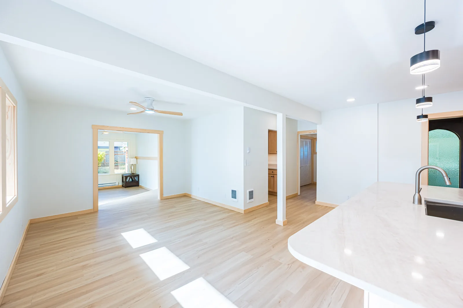 Kitchen counter looking into the adjoining living area in a home remodeled by CKS Builders LLC